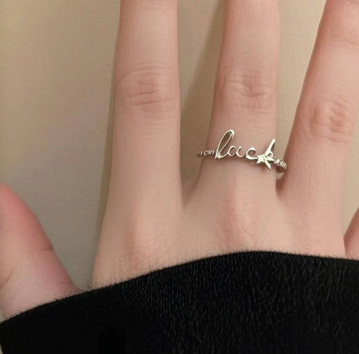 Lucky Script Ring – Minimalist Charm with Geometric Grace